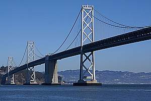 Double three-span suspension bridges