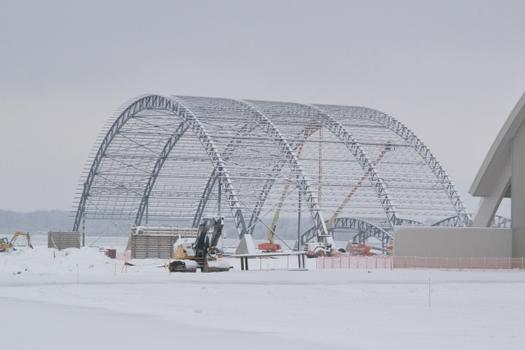 DAYTON, Ohio – Iron workers assemble steel archways during the first snowfall of the season. The 224,000 square foot building, which is scheduled to open to the public in 2016, is being privately financed by the Air Force Museum Foundation, a non-profit organization chartered to assist in the development and expansion of the museum's facilities