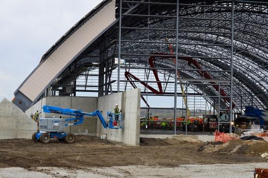 DAYTON, Ohio – Construction crews install concrete at the east end of the fourth building construction site on April 14, 2015, in Dayton, Ohio. The 224,000 square foot building, which is scheduled to open to the public in 2016, is being privately financed by the Air Force Museum Foundation, a non-profit organization chartered to assist in the development and expansion of the museum's facilities
