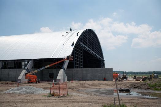 Dayton, Ohio – Crews working on the roof installation for the museum's fourth building on June 12, 2015. The 224,000 square foot building, which is scheduled to open to the public in 2016, is being privately financed by the Air Force Museum Foundation, a non-profit organization chartered to assist in the development and expansion of the museum's facilities