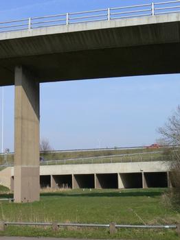 Flyover and embankment at the northern end of the bridge. The embankment is carried on a series of flood relief arches. The flyover was created as part of the redisgn of the crossing when the second bridge was built.