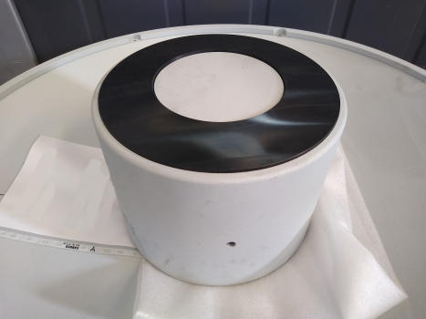 Unusual insight: a puck, the centrepiece of a SIP®-Bearing : The photo was taken during the overhaul of a prototype bearing following testing.