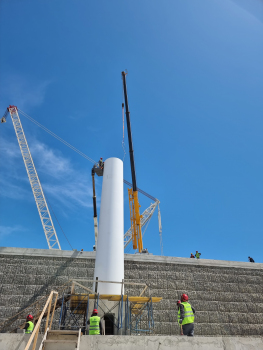 The tuned mass dampers were gradually inserted … : … and installed in segment 9 of the flagpole, before the complete segment was mounted on the mast.