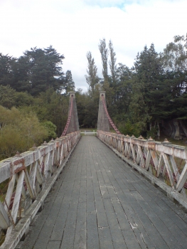 The Clifden Suspension Bridge in Southland, New Zealand. Looking roughly southwest