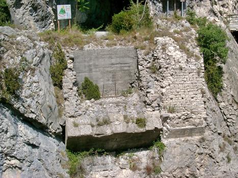Remains of the old bridge across the Var at Enriez