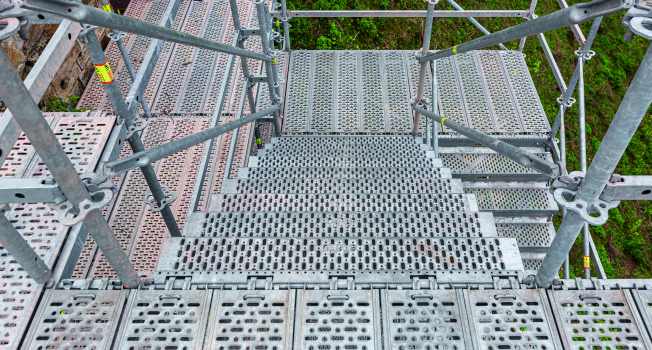 Scaffolding solution for the renovation of Hohenzollern Castle for proper historic preservation : Integrated access technology in the metric PERI UP system grid: 1.25 m wide stair flights and seamless connection to the working levels ensure a safe working environment.