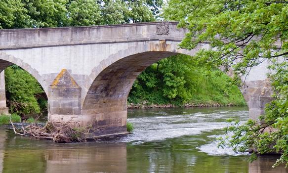 Historical three arch bridge Schulenburg over river Leine