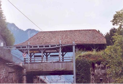 Spans the Lausanne-Montreux-Brig Railroad at the entrance to Chillon Castle. Open to pedestrian traffic only