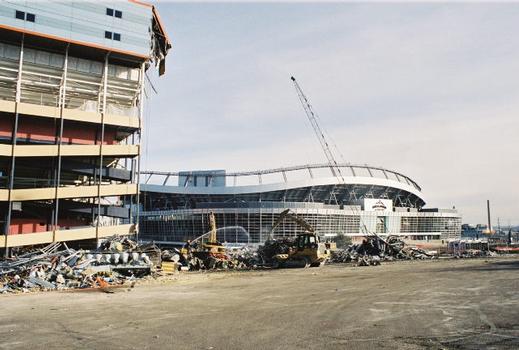 Mile High Stadium being demolished. Invesco Field - which replaced it - is in the background