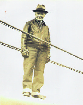 Holton Duncan Robinson at age 78 walking a suspension bridge cable. From the private collection of Ann Robinson Henshaw
