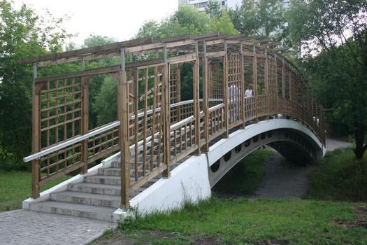 Pedestrian Bridge across Likhoborka River in a Moscow garden