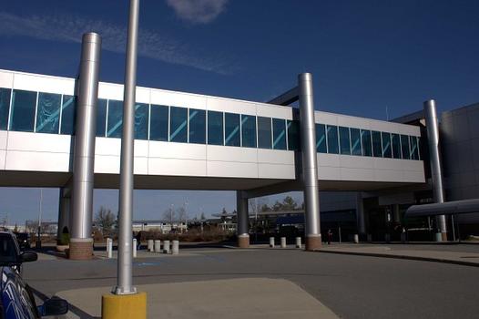 An elevated pedestrian walkway connecting the terminal and the parking garage, Manchester Airport, N.H