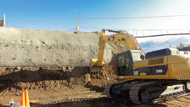 Following the soil nail installation, reinforcing steel mesh was applied and the soil face further stabilized by shotcrete.
: Following the soil nail installation, reinforcing steel mesh was applied and the soil face further stabilized by shotcrete.