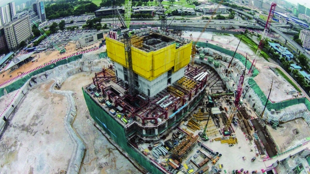 The building core is divided into two sections and is being built with automatic climbing formwork. The entire outside of a section can be repositioned in a single operation with hydraulic cylinders.