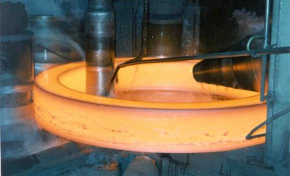 A steel ring is shaped under high temperatures into the right form