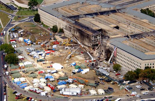 An aerial view, from the southeast, showing the level of the destruction at the Pentagon caused by a terrorist attack. The morning of September 11th, in an attempt to frighten the American people, five members of Al-Qaida, a terrorist group of fundamentalist Muslims, hijacked American Airlines Flight 77, then deliberately impacted the Pentagon killing all 64 passengers onboard and 125 people on the ground. The impact destroyed or damaged four of the five rings in that section of the building. Firefighters fought the fire through the night. The Pentagon was the third target by four hijacked aircraft, the twin towers of the World Trade Center (WTC) were the other targets, and one unknown when the passengers brought the aircraft down in a Pennsylvania field