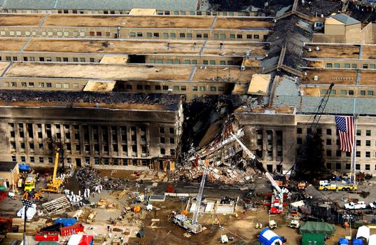 Aerial view of the Pentagon Building located in Washington, District of Columbia (DC), showing emergency crews responding to the destruction caused when a high-jacked commercial jetliner crashed into the southwest corner of the building, during the 9/11 terrorists attacks