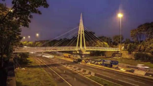 New Greystone Footbridge Installation - time-lapse:A new footbridge providing an impressive gateway at the Knowsley / Liverpool boundary was successfully installed over a weekend in October. 
The new, modern footbridge spans the M62 between Junctions 4 and 5 in Huyton, and is an eye-catching cable-stayed structure.
The replacement works involved more than 20,000 man hours, 100 tonnes of steel and 200 cubic metres of reinforced concrete. 
The new footbridge provides pedestrian and cyclist facilities which link the communities on either side of the motorway. It will be used by more than 400 people each day.