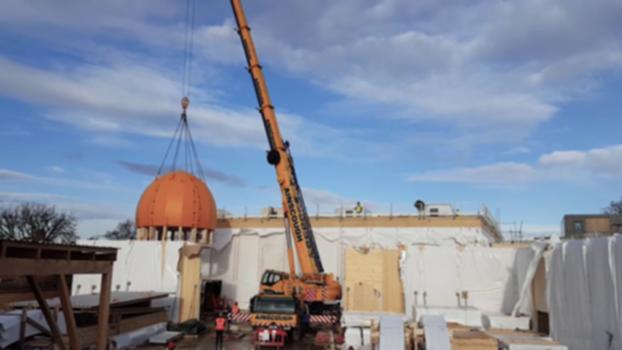 A Sacred Space:Cambridge Central Mosque construction has reached the half way mark.
"A sacred space with an ancient, timeless feel and built with the latest technologies."
This November 2017, the Blumer-Lehmann team led a ‘topping out’ ceremony to celebrate the hoisting into place of our feature dome. We have now reached the symbolic half-way point of our historic project!
A heavy-duty crane was hired for the occasion and the delicate operation passed off without a hitch. The dome is fabricated from cross-laminated timber harvested from sustainably-managed forests. Over the coming weeks the contractors will add a gold-coloured cladding material and a finial with a crescent.
DONATE: https://cambridgecentralmosque.org/donate/
For more information about Europe's first Eco-Mosque visit https://cambridgecentralmosque.org
CambridgeCentralMosque
Follow us:
Facebook: https://www.facebook.com/CambridgeCentralMosque
Instagram: https://www.instagram.com/cambridgecentralmosque
Twitter: https://twitter.com/CamCtrlMosque
© All Rights Reserved