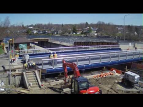 Hastings Swing Bridge - Time Lapse:AE Bridge Engineers have completed the swing bridge replacement project in the Village of Hastings of Ontario. 
This bridge is a central fixture within the community and the Trent Severn Waterway. The existing structure was approaching the end of it’s serviceable life and was taken out of service January 4th, 2016. This resulted in a 55km detour for the surrounding communities. AE Bridge Engineers had designed the replacement structure in 2015 in preparation of this replacement. 
The new bridge was constructed and returned to service just under one month ahead of schedule on April 29th, 2016 to much jubilation and celebration from the surrounding communities.
As part of this project AE installed a video camera to record a time lapse video of the construction process and ceremonial opening swing.