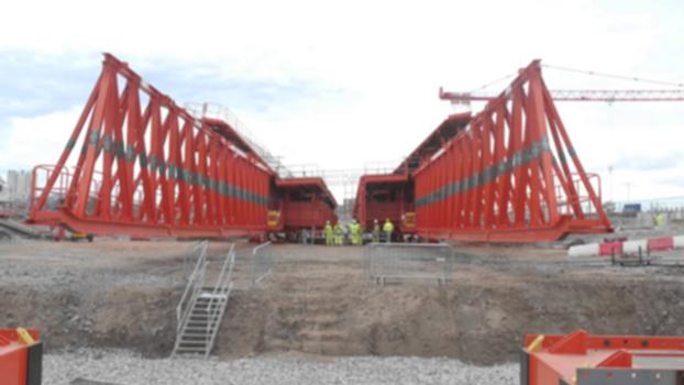 Mersey Gateway Bridge - Movable Scaffolding System Trinity Trial Launches - September 2015:The trial shows the MSS deck sections being dropped to separate each beam, then each section is moved sideways, then forwards and backwards. The short clip at the end is the nose being moved from side to side - it needs to do this to get round the gentle curve in the approach viaduct.