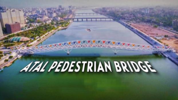 Atal Pedestrian Bridge I Atal Foot Over Bridge Sabarmati Riverfront Inauguration Ahmedabad:The bridge is located between Sardar Bridge and Ellis Bridge. It is designed by STUP Consultants Ltd based in Mumbai and built by P&R Infraprojects Ltd.
The design is inspired by kite festival organised in the city.
On 21 March 2018, a steel foot overbridge (pedestrian bridge) was approved by the Sabarmati Riverfront Development Corporation Ltd (SRFDCL) connecting both banks of Sabarmati river, at a cost of ₹74 crore (US$9.3 million).The Ahmedabad Municipal Corporation named it after former Indian Prime Minister Atal Bihari Vajpayee on his birth anniversary on 25 December 2021.
#AtalPedestrianBridge
#sabarmatiriverfront 
#ahmedabad 
#bridgeconstruction 
Atal Pedestrian Bridge Inauguration By PM Modi
Atal Walk Bridge Ahmedabad
Atal Pedestrian Bridge Drone Shot
Atal Bridge Drone Shots
Sabarmati Riverfront Bridge
Sabarmati Riverfront Footover Bridge
Atal Setu Drone Shot
New Bridge Inauguration india
Atal Pedestrian Bridge Ahmedabad