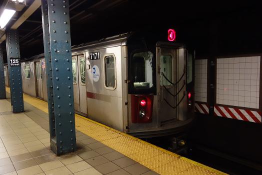 A Brooklyn-bound 4 train leaving at the 125th Street IRT Lexington Avenue station in East Harlem, Manhattan.