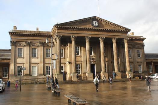 Huddersfield railway station looks out across St George's Square. The grand scale of the buildings was to suit the local landowner but has meant that it merits four stars in Simon Jenkins' .