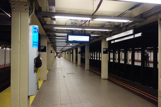 Looking north along the Downtown platform of the 57th Street–Seventh Avenue BMT station in Midtown Manhattan.