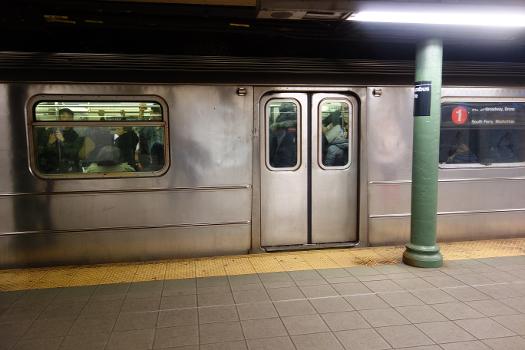 A Van Cortlandt Park, Bronx-bound 1 train leaving the 59th Street–Columbus Circle IRT station in Columbus Circle, Midtown Manhattan.