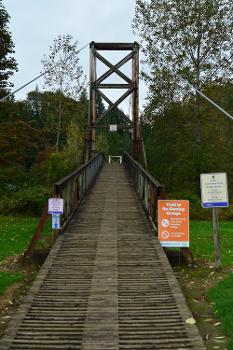 Approaching pedestrian suspension bridge over the Snoqualmie River, Tolt-MacDonald Park, Carnation, Washington:Approach from the east.