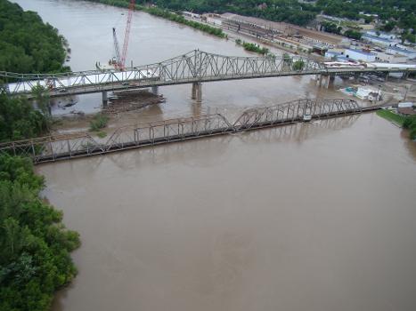 Atchison Rail Bridge : Debris continues to collect under the bridge in Atchison, Kan., June 27, 2011. The railroad bridge has water nearing the bottom.