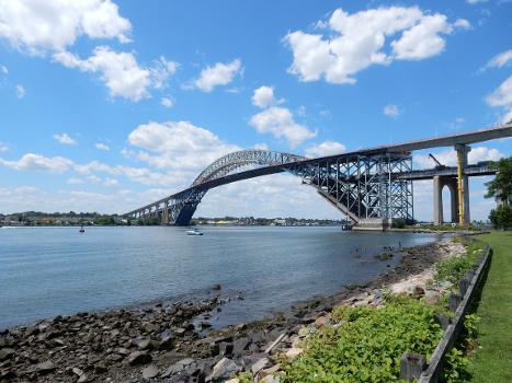 The Bayonne Bridge with older roadway partially removed, allowing larger "new Panamax" ships to pass under.