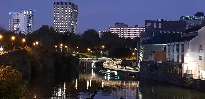 Castle Bridge:The Castle Bridge across the upper reaches of Bristol Harbour, in the UK, at night. The Castle Green park is to the left, and Finzels Reach development to the right. Buildings near Cabot Circus form the backdrop.