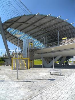 Central Park Metrolink station is a tram stop featuring a striking curved copper and glass canopy suspended by a cable-tensioned steel structure:The station serves The Central Park Urban Regeneration Area in north-east Manchester. It forms part of The Gateway, a £36.5 million transport interchange which will include local bus services as well as the Metrolink tram stop.
