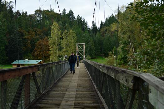Crossing pedestrian suspension bridge over the Snoqualmie River, Tolt-MacDonald Park, Carnation, Washington:Looking west.
