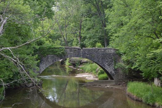 Fountain Creek Bridge : Northern side of the Fountain Creek Bridge, which formerly carried the Valmeyer road west of Waterloo in Precinct 22, Monroe County, Illinois, United States. Built in 1849, it is listed on the National Register of Historic Places.
