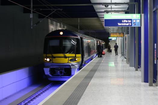 Heathrow Express train prepares to depart from platform 3 at Heathrow Terminal 5 station with a service to London