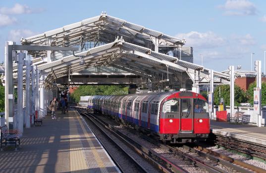 A Piccadilly Line 1973 stock train arrives at Hillingdon tube station, operating a service to Hillingdon