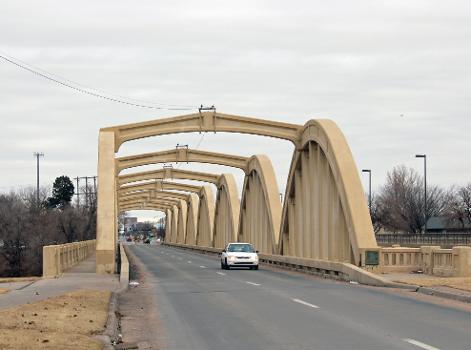 The John Mack Bridge, located on South Broadway in Wichita Kansas : This rainbow arch bridge was built in 1931 and is listed on the National Register of Historic Places. It goes over the Arkansas River.