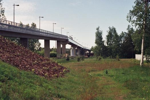 Kiskopolku Bridge, a pedestrian/bicycle bridge built to cross the VR railyard in Oulu, Finland:Originally opened in 1981, the bridge was lenghtened and otherwise renovated in 2009. The lengthened/extended end of the bridge is seen in the photo