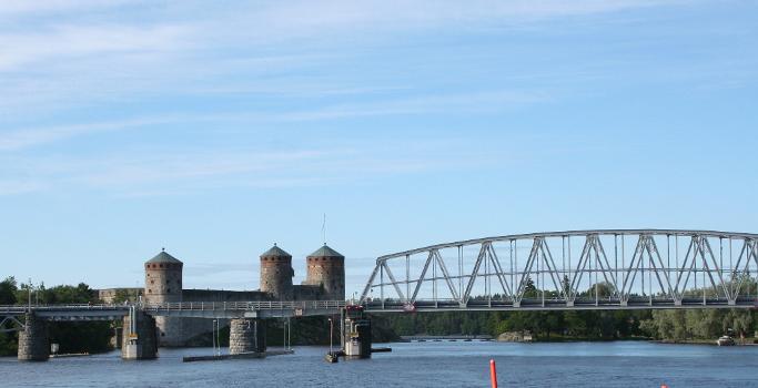 Kyrönsalmi railway bridge and Olavinlinna castle in Savonlinna, Finland