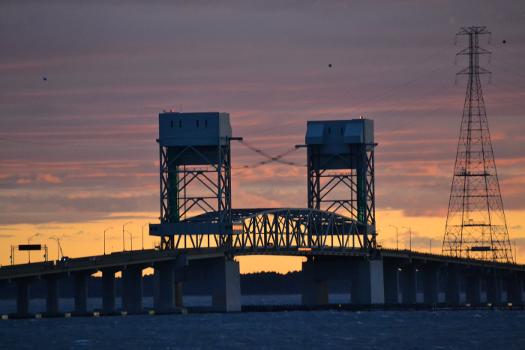 The central portion of the James River Bridge, with vertical-lift span, at sunset