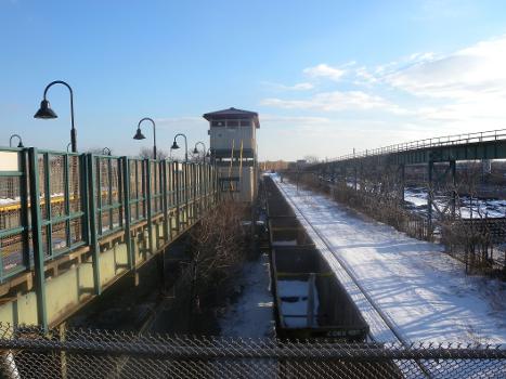 Looking south from staircase at southbound side of Livonia station of Canarsie line, New York City Subway, on a sunny afternoon