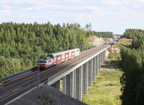 An Intercity train crossing Luhdanmäki railway bridge on the Kerava–Lahti railway, Finland