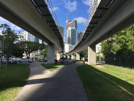 The M-Path goes along or underneath the Metro line (and a busway further south) in southern Miami:It is part of the East Coast Greenway hiking/biking trail.