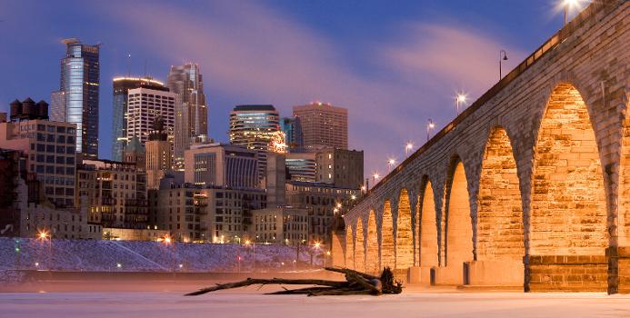 Downtown Minneapolis from across the Mississippi River : One the right, the Stone Arch Bridge.