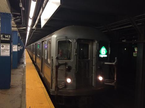A 6 Train with a consist of R62As making a stop at East 143rd Street bound for Brooklyn Bridge–City Hall