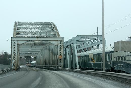 The Rautasilta, former railway bridge in Oulu, on the left and the new railway bridge with train on it on the right : The Rautasilta was completed in 1886 and the new railway bridge 1964
