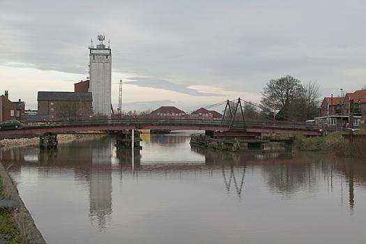 River Ouse at Selby:Looking west to the road swing bridge and the Westmill Foods grain silos.